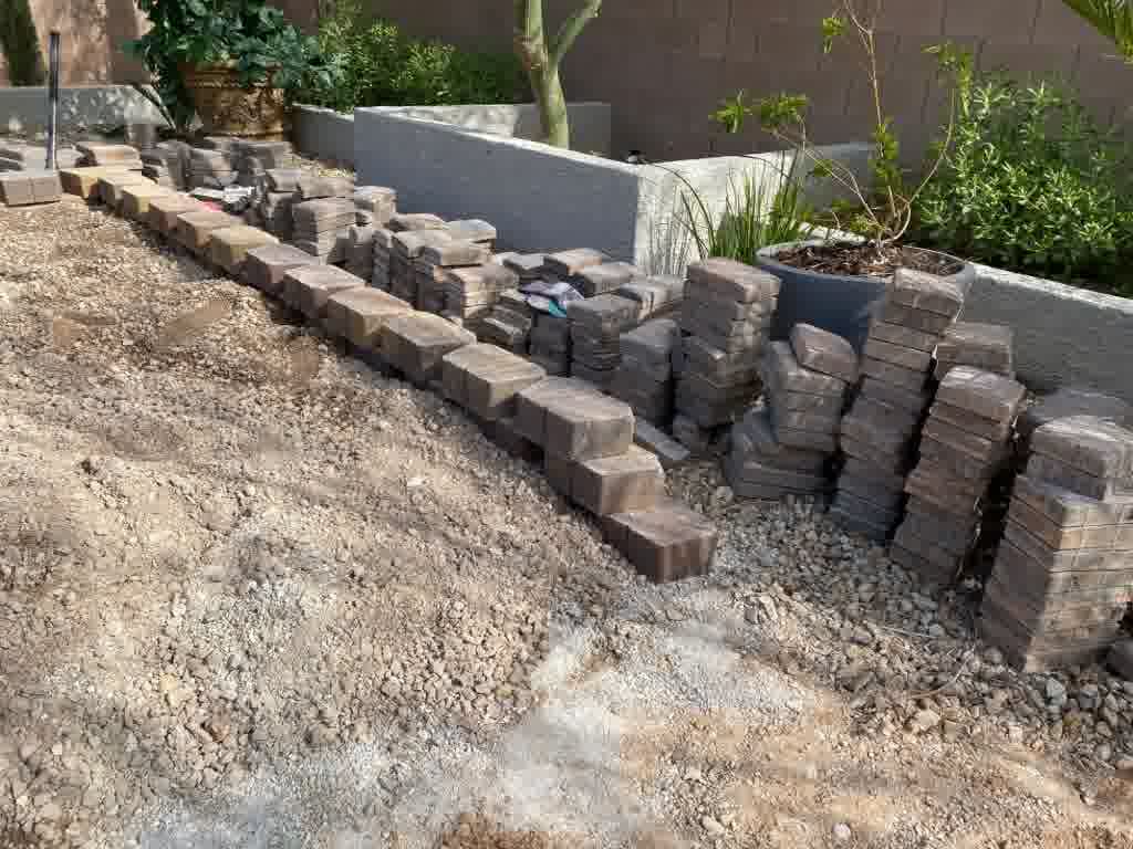 A wonderful retaining wall in the process of being installed by professionals.